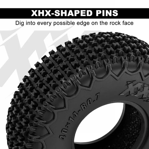 Close-up of XHX 0.7 Inch Pin Tires 40x14mm for 1 To 30 Scale Axial SCX30 RC Car, showing tread pattern and XHX-shaped pins.