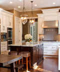 Kitchen with Six Pack 5 Inch Antique Brass Cabinet Handles With Linear Coin Edge Texture on white cabinets