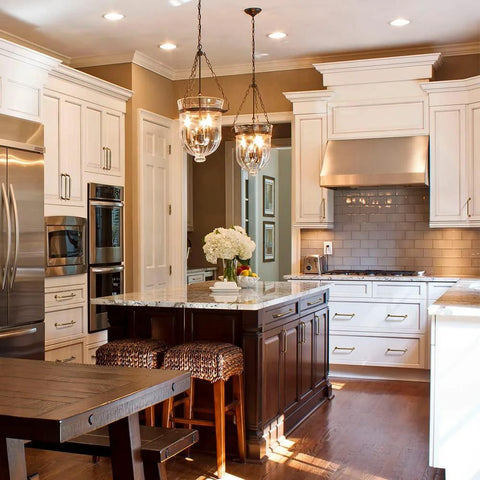 Kitchen with Six Pack 5 Inch Antique Brass Cabinet Handles With Linear Coin Edge Texture on white cabinets