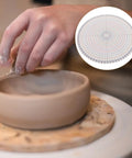 Heavy Duty Pottery Circle Divider Lays Dead Center For Precision Clay Slab Layout And Ceramic Wheel Projects on a potter's wheel.