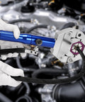 Close-up of Hydraulic Hose Crimper For Auto AC Handheld Crimp Tool With Snap On 7 Die Set Hydra Krimp in use on engine