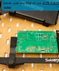 Hands Free Through-Hole Soldering Jig For PCBs And Breadboards CSJ-1 holding a green PCB on a perforated surface, size 4.75 x 2.75 inches