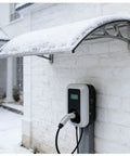 Heavy Duty Electric Vehicle Charging Station Roof Cover with snow, outdoor weatherproof awning mounted above EV charger.