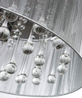 Close-up of raindrop crystal drum chandelier with fabric shade, highlighting K9 crystal details and sparkling accents.