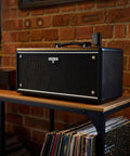 Powerful Wireless Desktop Amplifier For Guitar And Bass With Dual Five Inch Speakers Delivers Rich Stereo Tone on shelf