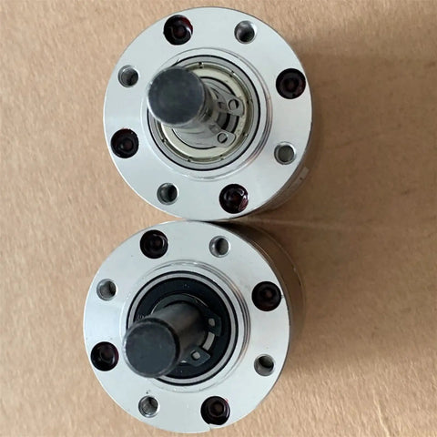 Top view of two Kickass 42mm Planetary Reducer Gearbox components with mounting holes for DC worm motor applications.