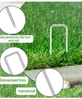 100 Pack 6 Inch Garden Stakes Galvanized Landscape Staples For Weed Barrier Fabric Heavy Duty Sod Pins Securing Pegs Ground Sheets Netting And Irrigation Tubing in use on grass