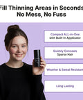 Dark Brown Hair Powder Root Touch Up Stick For Fast Gray Coverage held by a woman in a black sweater against purple backdrop.