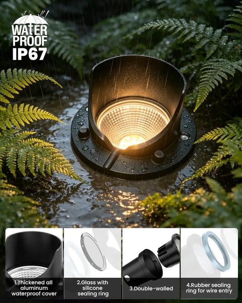 Close-up of Six Pack Low Voltage Landscape Lighting Kit with 12W Well Lights in wet garden, showcasing IP67 waterproof feature.