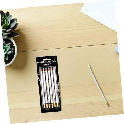 Six Piece Sketching Pencils Set for Drawing, Pro Grade Graphite Leads for Artists and Students on a wooden desk