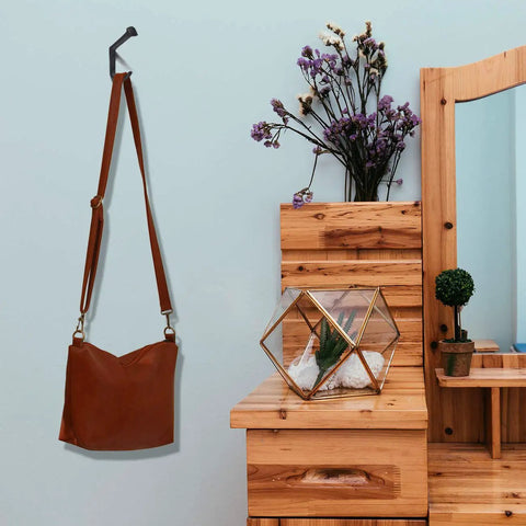 Rustic Cast Iron Wall Mount Coat Hook with brown leather bag in entryway, farmhouse style towel hanger and heavy duty wall hooks set of 4