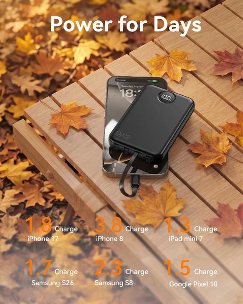 Pocket Sized 10000 Mah Portable Charger With Four Built In Cables Ultra Slim Power Bank For iPhone And Android Fast Charging Battery Pack on a wooden surface with leaves.