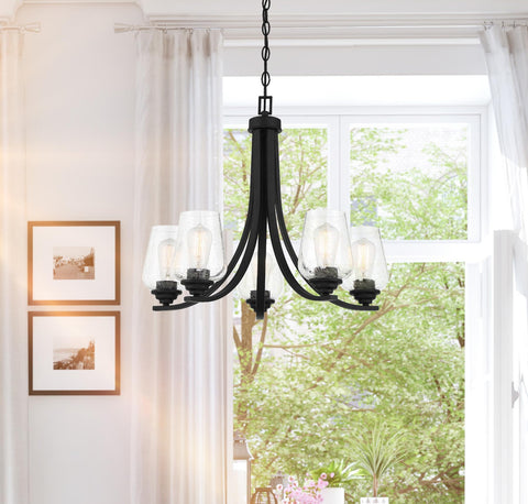 Shyloh 3 Light Chandelier in Coal Black with clear seeded glass shades in a bright room, dimmable, modern industrial vibe, 19.75 inch diameter
