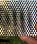 Close-up of Pro Grade Heavy Duty 19 Gauge Stainless Steel Perforated Metal Sheet 304 with 3mm holes in polished finish.