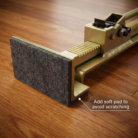 Close-up of Pro Grade Flooring Jack For Hardwood Installations With Ratcheting Alignment Tool showing soft pad for protection.