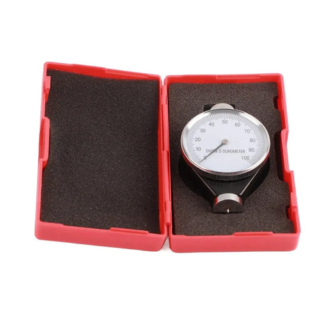 Hardness Tester For Type A O And D Scales With Simulated D Type Display Quick Easy Read Dial Built Tough From Rust Resistant Alloy Build Ideal For Testing Hardness In Plastics And Sulfur Goods Durable Accurate Fast Results, red case open with Shore D durometer