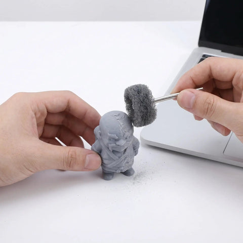 1 Inch Mini Polishing Wheels Set 100 Pcs Abrasive Buffing Wheels with a rotary tool on a 3D printed figure for post-processing