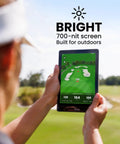 Portable Golf GPS Tablet The Caddie With 8 Inch Touchscreen And Magnetic Weatherproof Body FCB Distances 45000 Course Maps No Subscription Required The Ultimate Golf Caddy Gift For Men Gray being used on a sunny golf course
