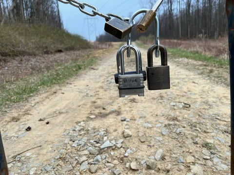 Heavy Duty Multi User Padlock Holder Provides Solid Gate Or Door Security Supports Four Independent Keys on a chain with locks.