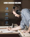 Man wearing Bluetooth Five Point Three Hearing Protection Earmuffs with NRR 25dB working at a workshop table