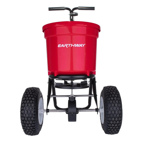 Front view of Heavy Duty 50 Lb Broadcast Fertilizer Spreader For Lawns, Walk Behind Push Seeder With Adjustable Drop Rate, Rugged Drive Handle, Large 13 Inch Pneumatic Stud Tires, Clog Free Grate For Smooth Material Flow