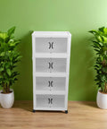 Heavy Duty Four Tier Wheeled Storage Cart With Lids Stackable Foldable Plastic Organizer Bins in a green room with plants.