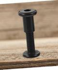 Premium Binding Screws And Countersunk Cap Nuts Designed For Hassle Free Install On Scrapbooks close-up view of black screw