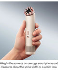 Hand holding HushJet Mini Personal Fan With Quiet Evaporative Cooling, up to fifty-five MPH airflow, in stone and blush color