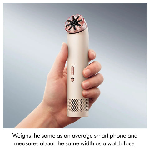 Hand holding HushJet Mini Personal Fan With Quiet Evaporative Cooling, up to fifty-five MPH airflow, in stone and blush color