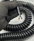 Heavy Duty Two Core Coiled Extension Cord With Smooth Retractable Stretch Design that showcases durable conductors and coil design.