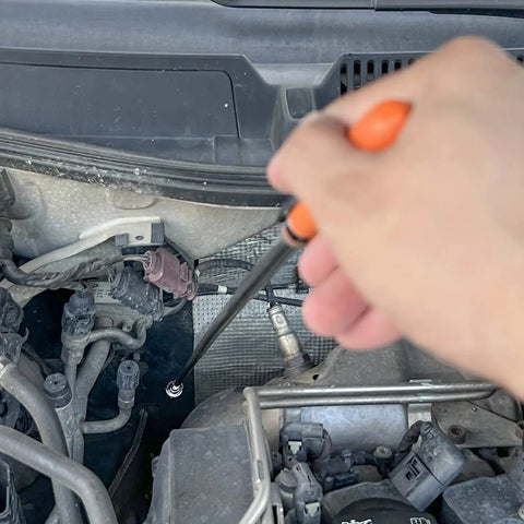 Using Extendable 31 Inch Magnetic Pick Up Tool With 20 Lb Pull Force, retrieving metal part in car engine bay.