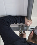 Heavy Duty Nylon Garage Door Rollers With Sealed 6200ZZ Bearings And 2 Inch Wheels being installed on a garage door.