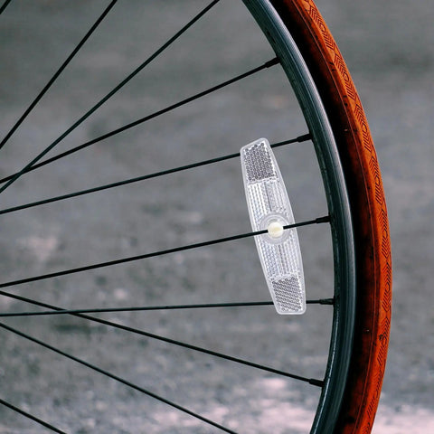 Six Piece Bicycle Spoke Reflectors White Safety Wheel Reflectors Set attached to bike wheel