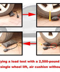 Beefy Heavy Duty Three Piece Air Wedge Bag Pump Kit lifting a vehicle wheel for precise leveling and alignment.