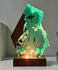 Ocean Resin Lamp With Scuba Diver Scene And Lit Multicolor LED Glow on wooden base, featuring manta ray, sea turtle, divers, and corals.