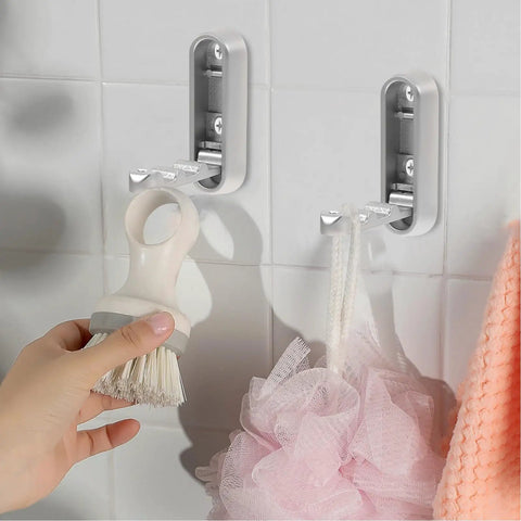 No Sweat Foldable Invisible Wall Hooks Zinc Alloy Storage Hangers 4 Pack for hanging a shower brush and pouf in bathroom.