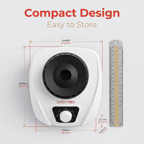 Top view of On The Go 1200W Portable Clothes Dryer with ruler for size reference, highlighting compact design.