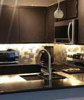 Modern kitchen with Peel And Stick Metal Backsplash Panels 12 By 12 Inch Square, 10 Piece Puzzle Set In Silver, Dry Install No Mess.