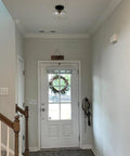 Matte Black Flush Mount Ceiling Light With Clear Glass Shade for hallways in modern vintage style, above entryway door.