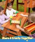 Children playing at 2-in-1 outdoor table, part of Cedar Wooden Swing Set For Backyard With Monkey Bars, 6-Foot Wave Slide, and Climbing Wall