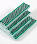 Stacked green FR4 boards from 20 Piece Double Sided PCB Prototype Kit For DIY Projects Four Sizes Includes Five Boards Per Size