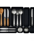 Eight Piece Interlocking Drawer Organizer Trays That Lock In Place used for kitchen utensils in black modular trays