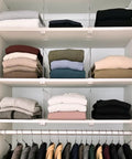 8 Pack Acrylic Shelf Dividers For Purses And Handbags Closet Organizer Bag Storage For Handbags Clutches Clothes Towels On Wood Shelves Space Saving And Easy Access installed on closet shelves with folded clothes.