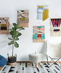 Room with decorative wall hangings made from a Wooden Weaving Loom Kit for kids and adults, showcasing tapestry designs.
