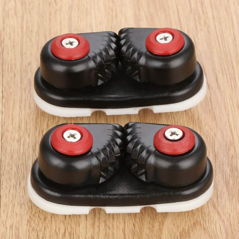 4 Pack Aluminum Kayak Cam Cleats Fast Entry Marine Cleats For Boats Canoes Sailboats Dinghies And More Durable Hardware For Quick Rigging Secure Lines And Easy Ties, showing top view with red and black design, on wooden surface.