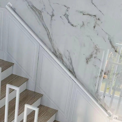 Rock Solid Eight Point Two Foot Modern Wrought Iron Grab Rail With Heavy Duty Wall Mount Brackets Smooth White Finish installed on interior staircase.
