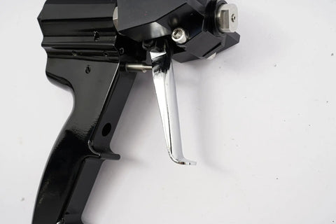 Close-up of Heavy Duty Polyurethane Foam Spray Gun With Air Purge Self Cleaning Pu Foaming Tool trigger and handle.