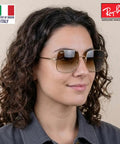 Woman wearing RB1971 Square Shape Stylish Sunglasses For Women Non Polarized With Clear Gradient Brown Lenses Includes Official Eyewear Kit Your Go To Formal And Casual Everyday Wear.