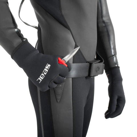 Diver holding Samurai Underwater Dive Knife With 2.7-Inch Tempered Stainless Blade, 5.9-Inch Overall, Secure Eyelet Tie Attachment