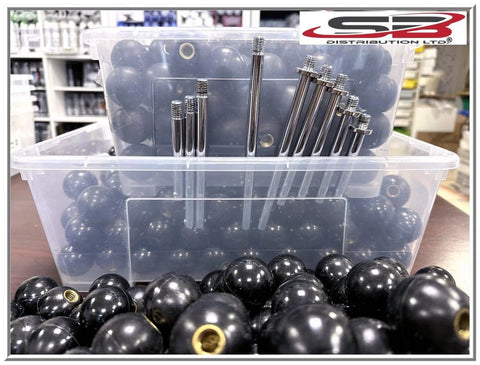 Front view of black phenolic ABS ball knobs with brass inserts, 3/8-16 thread, in a clear storage bin (SB Distribution)